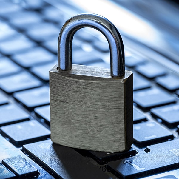 A padlock on a laptop keyboard